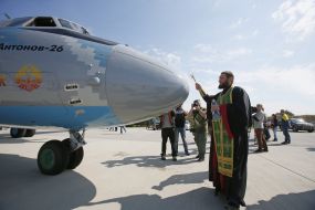 A priest consecrates the AN-26