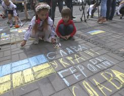 Children draw chalk on asphalt