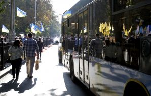People walking along the road near the Verkhovna Rada of Ukraine