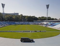 Hearse with the body of Andrew Gusina makes farewell circle at the stadium "Dinamo"