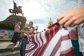 Mother with baby during the parade of Sling