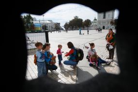Mother with children during the parade of Sling