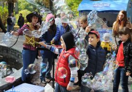 Children blow bubbles