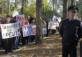 Activists hold placards