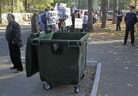 Activists hold placards