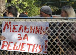 Activists hold placard