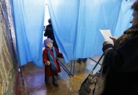 A child at a polling station
