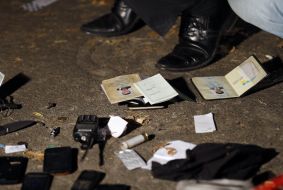 Militiamen inspect the seized things