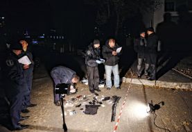 Militiamen inspect the seized things