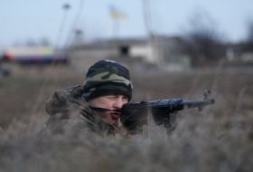 A boy plays in the war