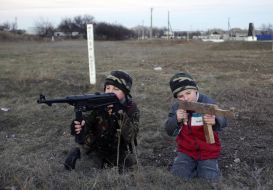 A boy plays in the war