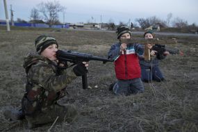 A boy plays in the war