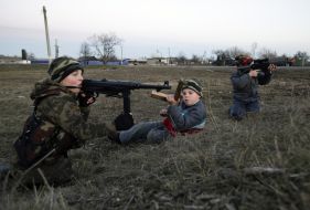 A boy plays in the war