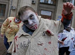 Activists in zombies costumes
