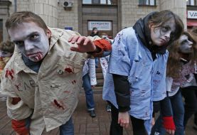 Activists in zombies costumes