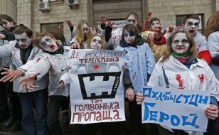 Activists in zombies costumes