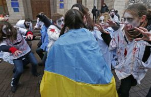 Activists in zombies costumes