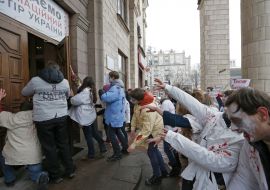Activists in zombies costumes