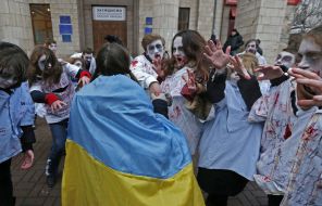 Activists in zombies costumes