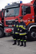 Polish firefighters near their cars