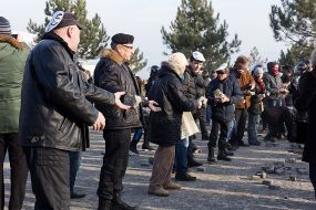 Activists pass disassembled pieces of roadway