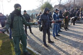 Activists pass disassembled pieces of roadway