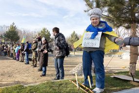 Activists pass disassembled pieces of roadway
