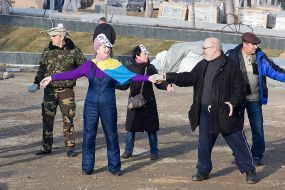 Activists pass disassembled pieces of roadway