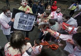 Activists in zombies costumes