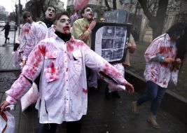 Activists in zombies costumes