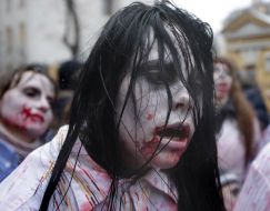 Activists in zombies costumes