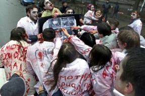 Activists in zombies costumes