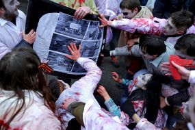 Activists in zombies costumes