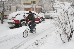 A man rides a bicycle