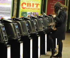 People pass through the turnstiles in the subway