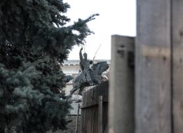 Construction fence around the monument to Sagaydachny
