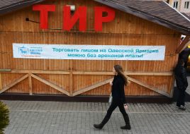 A girl walks past a shooting gallery