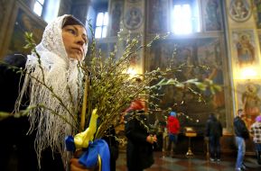Woman holding willow branches