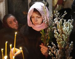Parishioners during the consecration of willow