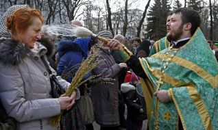 The priest blesses the willow