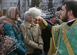 The priest blesses the willow