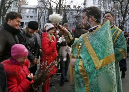 The priest blesses the willow