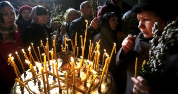 Parishioners during the consecration of willow