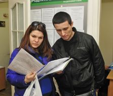 Couple familiarize with the documents for the subsidy