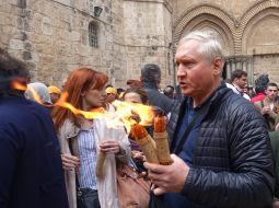 People receive Holy Fire