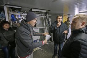 People near the shattered kiosk