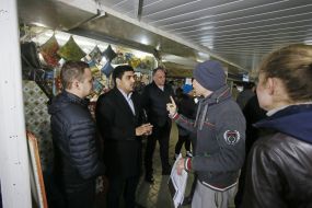 People near the shattered kiosk