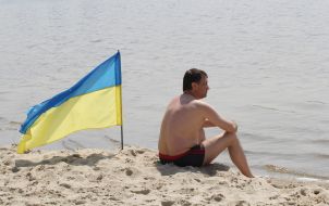 A man sitting on the beach
