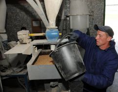 Convicted sews a sack of flour
