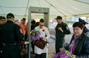 A woman walks through a metal detector before the event